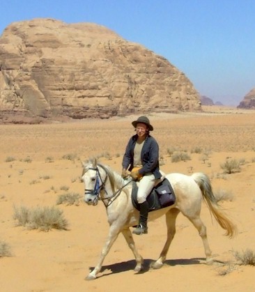 David riding Adrienne in Wadi Rum, Jordan